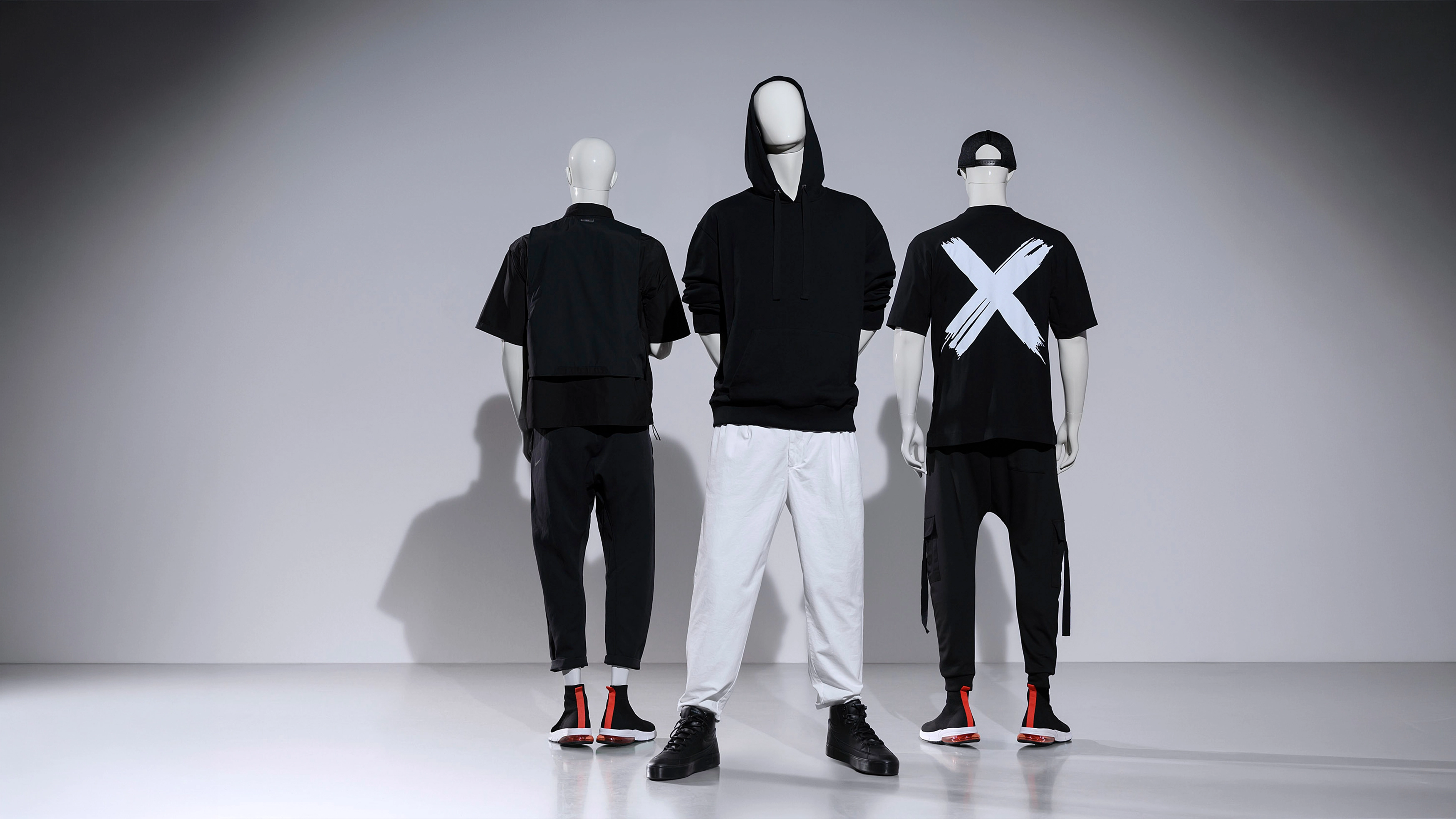 A group of male mannequins from the blend collection in black clothes