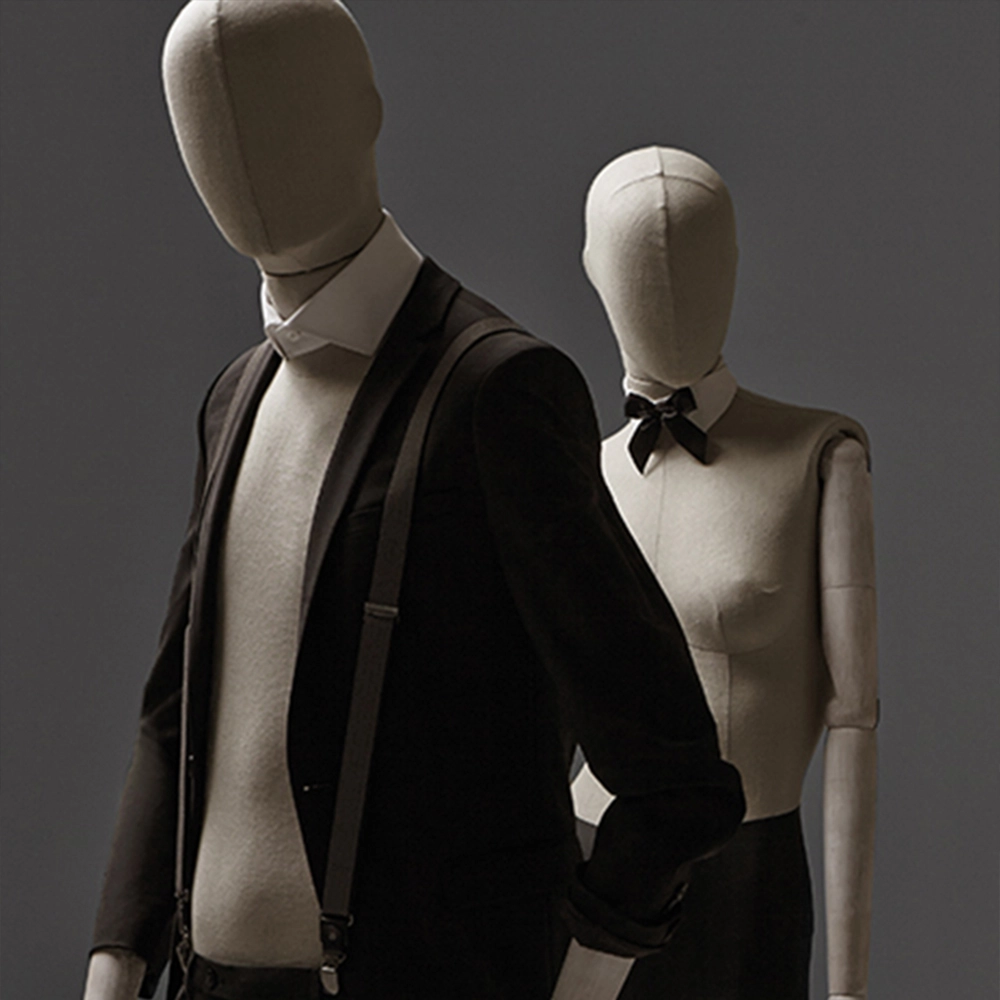 a pair of female and male mannequins from the casual fabric collection walking together