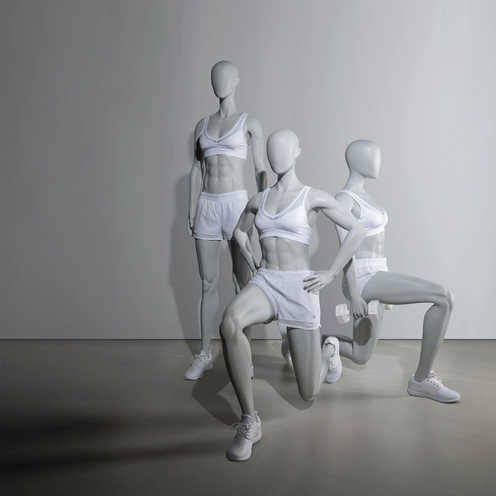 a group of three female sport mannequins in fitness poses
